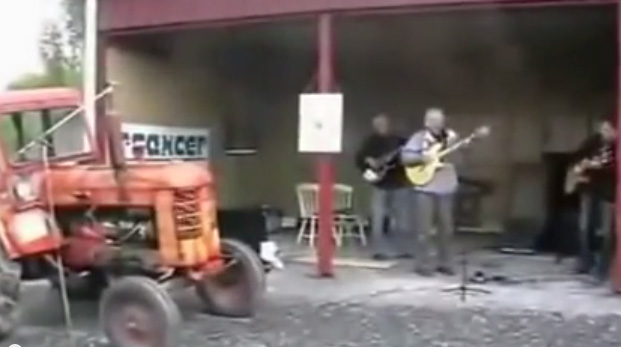 two guitarists, one bassist and vintage tractor drummer
