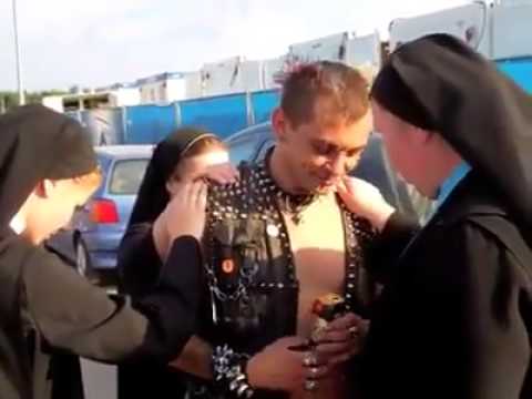 Nuns performing exorcism on a punker.