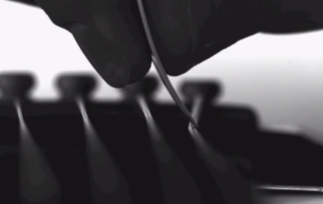 Slow-Motion Camera Captures Guitar Strings in Motion