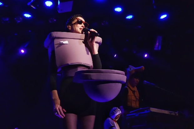 St. Vincent Performs New Song in Toilet Costume