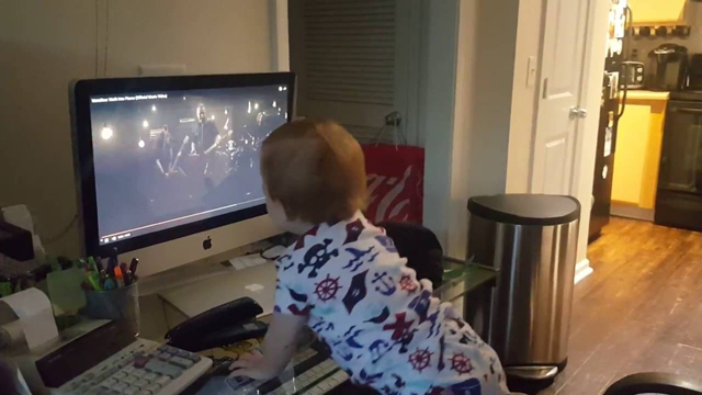 Baby rocking out to Metallica's 