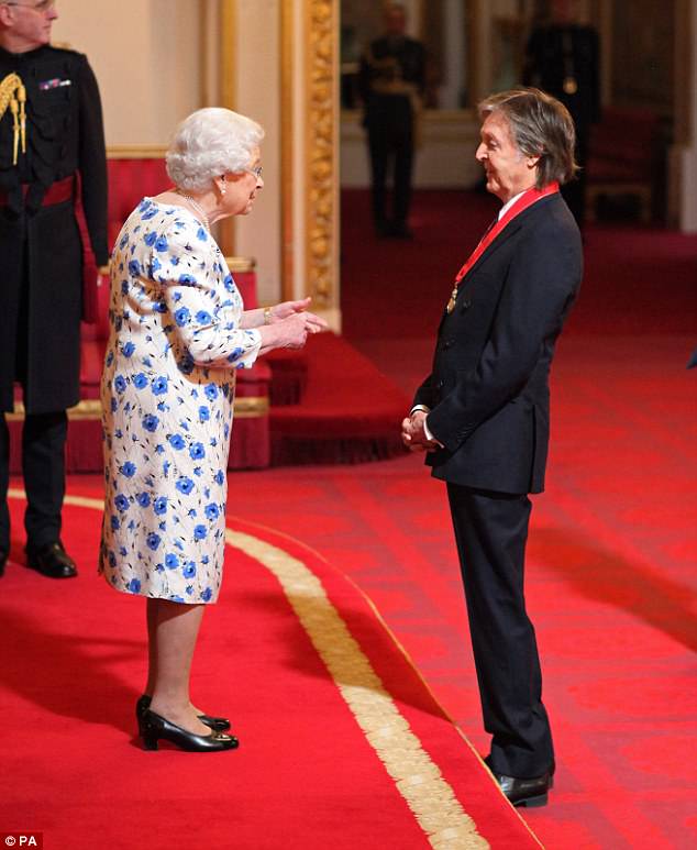 Paul McCartney and Queen Elizabeth II at Buckingham Palace