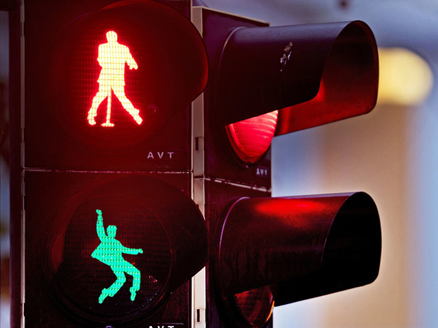 Silhouettes of Elvis Presley appear on a traffic light in Friedberg, Germany - Photo/Michael Probst