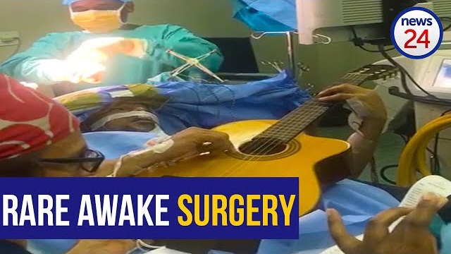 The moment jazz star Musa Manzini plays his guitar during rare awake brain surgery