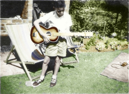 Brian May in 1958, age at 11, with his first guitar