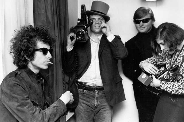 D.A. Pennebaker (center) with Bob Dylan during the filming of Don’t Look Back (Photo by Michael Ochs Archives/Getty Images).