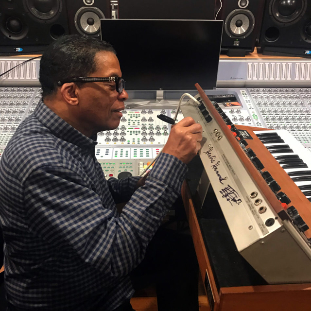 The inimitable Herbie Hancock signing the back of our vintage Minimoog Model D