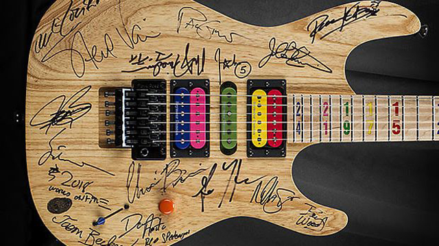 A Kiesel JB24 Jason Becker tribute guitar signed by a number of guitar legend