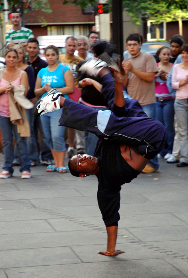 A b-boy performing outside Faneuil Hall, Boston, United States