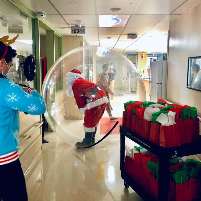 Santa is visiting all the patients (inside a Space Bubble) in the Childrens Hospital in downtown Oklahoma City