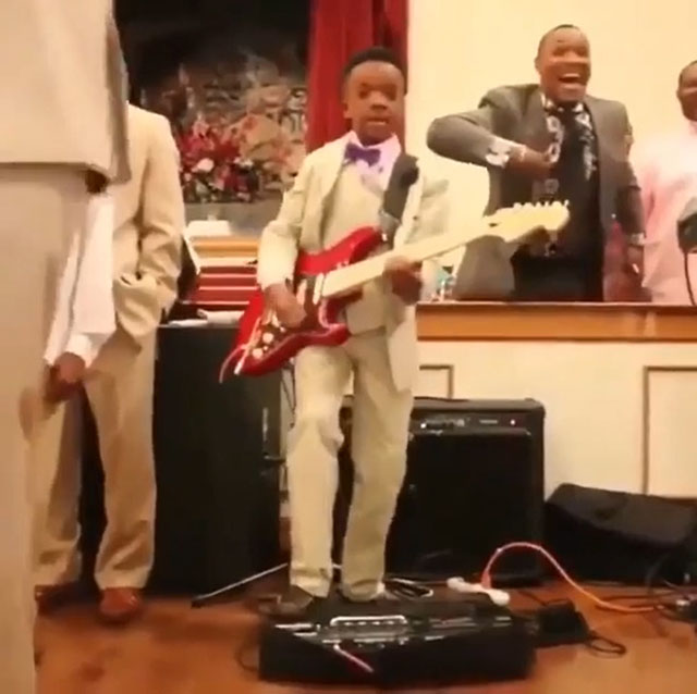 A father's humorous reaction as he proudly watches his son perform