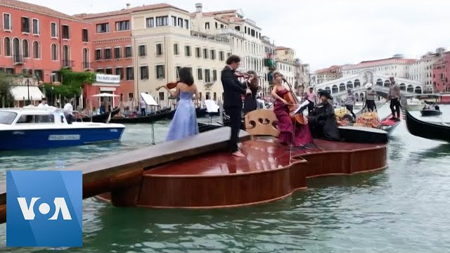 String Quartet Plays Vivaldi on Giant Violin Floating Down Venice Canal
