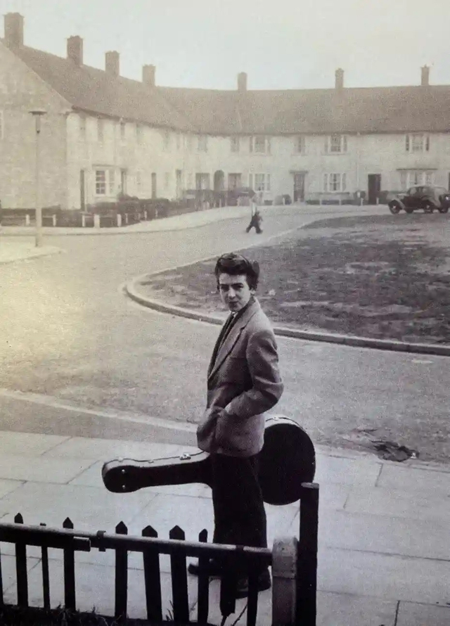 George Harrison outside his childhood home in Speke. Photograph: Omega Auctions