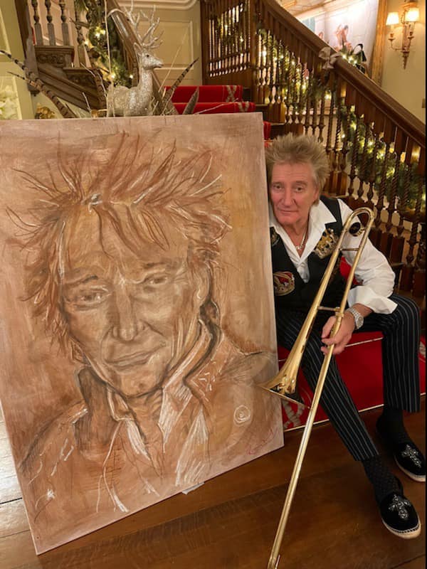 Rod Stewart shows off a giant portrait Ronnie Wood painted
