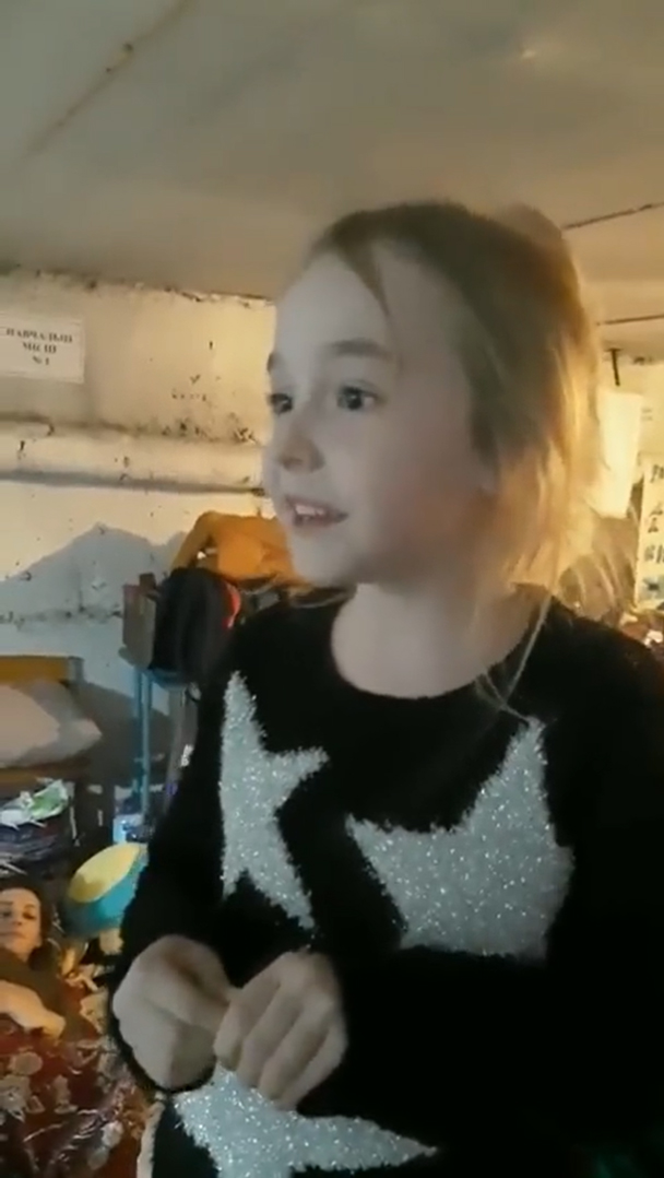 little girl in Ukrainian shelter sing 