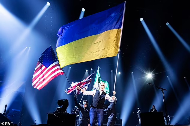 Paul McCartney was pictured holding a Ukraine flag in Spokane on the first leg of his 'Got Back' tour