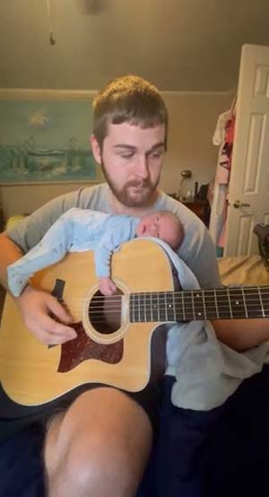 Infant Falls Asleep to Soft Sounds on Dad's Guitar