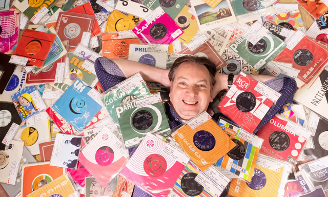 ‘I don’t really know why I started it!’ Dave Watson and his collection of UK No 1 singles. Photograph: Graeme Robertson/The Guardian