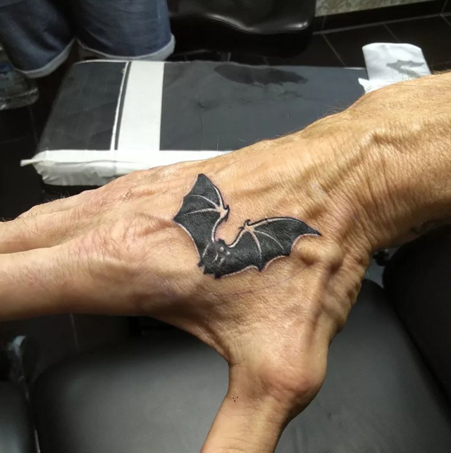 Duff McKagan’s small bat tattoo