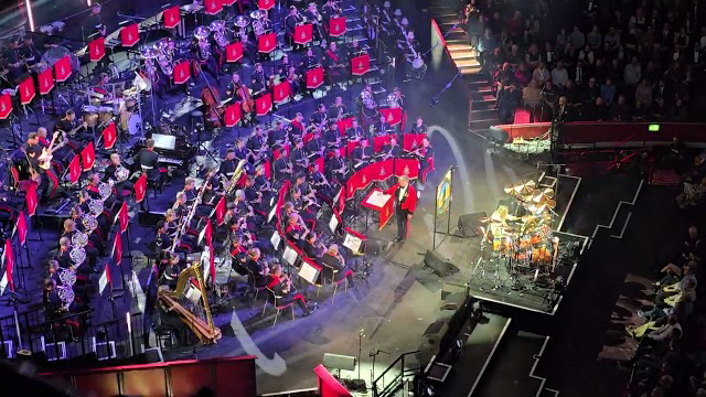 Iron Maiden's Nicko McBrain with the the Massed Bands of His Majesty’s Royal Marines