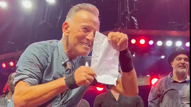 Bruce Springsteen signs absentee note (Facebook)