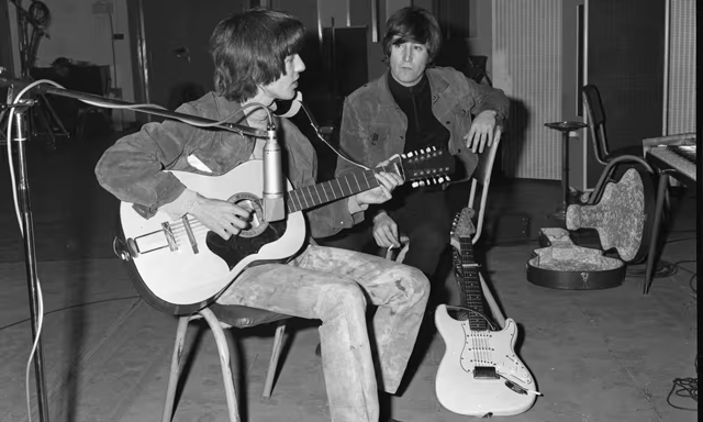 George Harrison plays John Lennon’s Framus 12-string Hootenanny acoustic guitar. Photograph: Julien's Auctions/ Beatles Photo Library