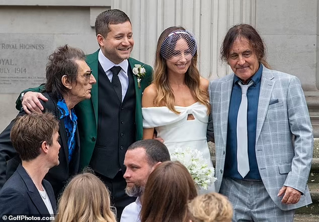 Ronnie Wood and Steve Harris with their children following the ceremony