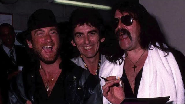 Deep Purple’s Roger Glover and Jon Lord with George Harrison backstage in Sydney in 1984 (Image credit: Bob King/Redferns)