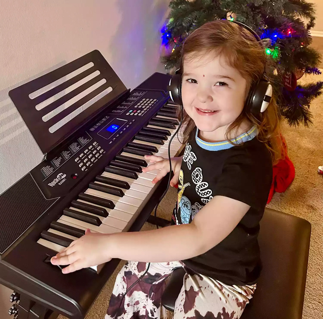 arisa Shumaker's daughter playing the keyboard. Photo: Marisa Shumaker