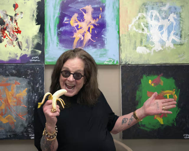 Ozzy Osbourne with paintings he made with rescued chimpanzees. Photograph: Kamil Szkopik