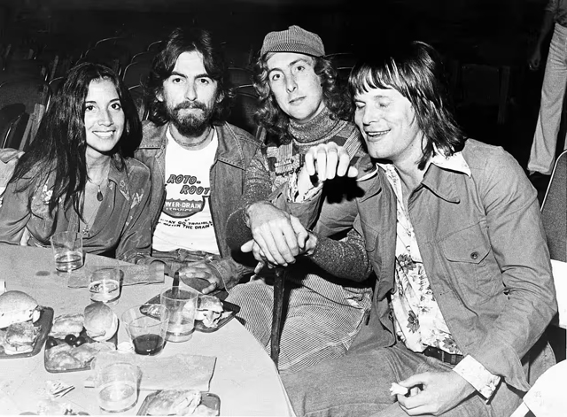 Olivia Arias,  George Harrison,  Eric Idle, Terry Gilliam - July 1975. Photograph: Trinity Mirror/Mirrorpix/Alamy