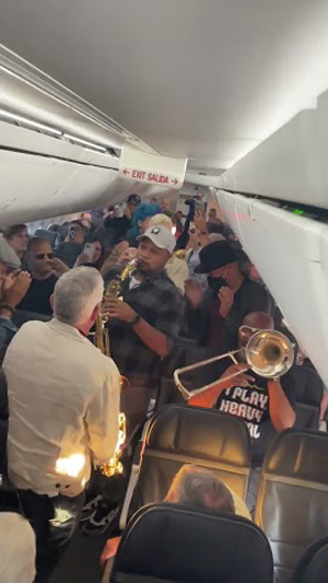 Jazz Band Plays Impromptu Concert Inside a Plane for Frustrated Passengers During Flight Delays