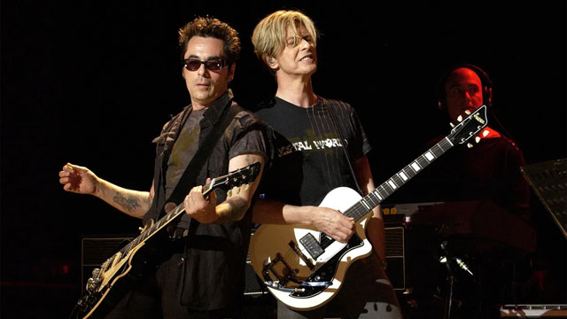 Earl Slick and David Bowie - A Reality Tour, August 19, 2003. (Image credit: KMazur/WireImage)