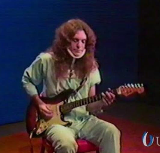 Allen Collins playing guitar in hospital shortly after Lynyrd Skynyrd plane crash