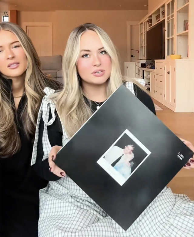 Alli Maxfield and her sister holding up the gift. (c)Alli Maxfield